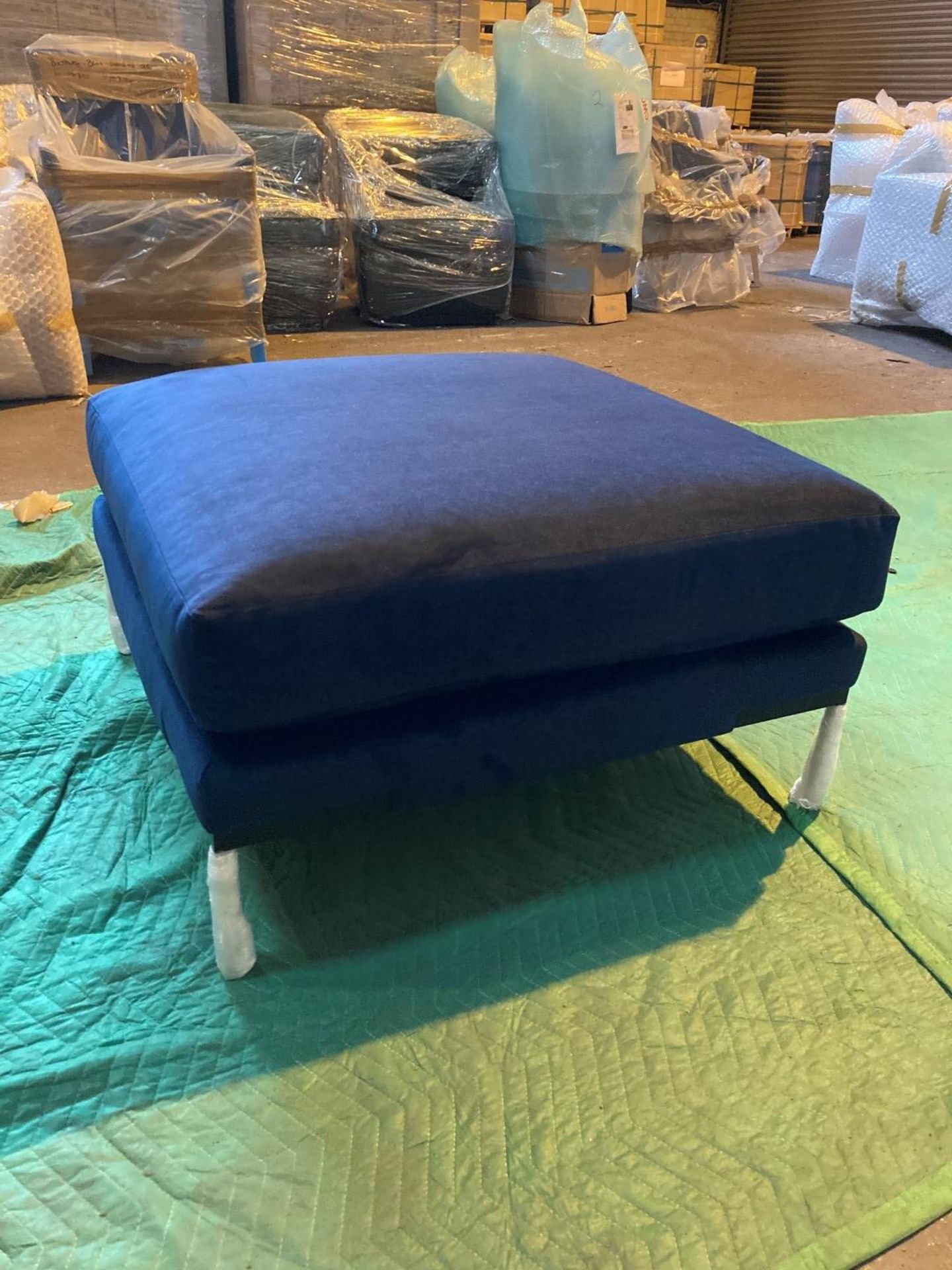 Plush indigo ottoman footstool