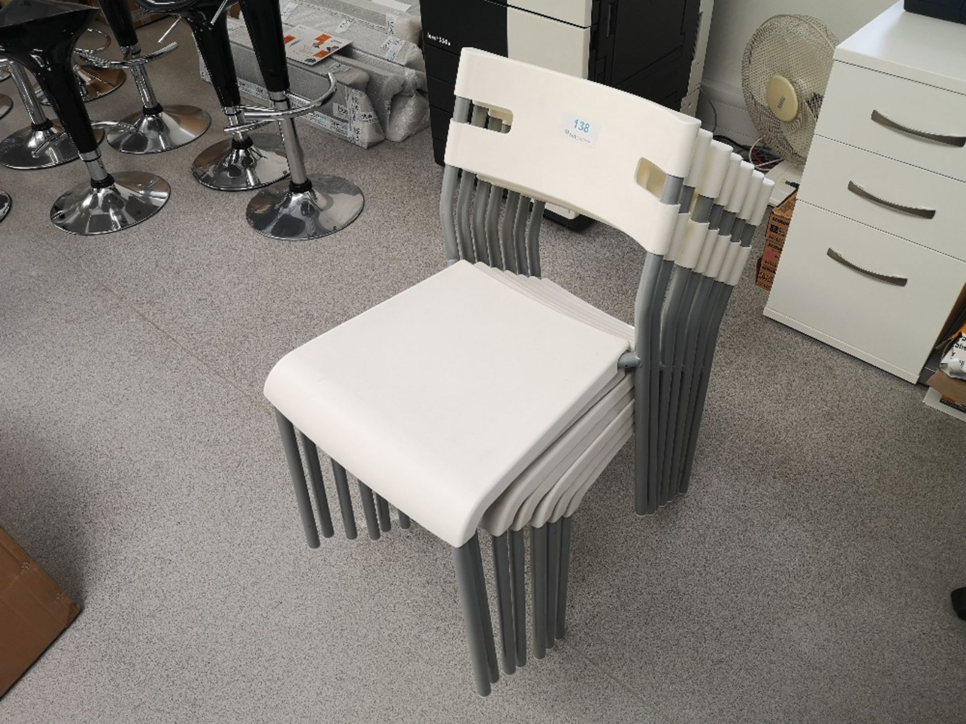 (7) Cream plastic stackable chairs