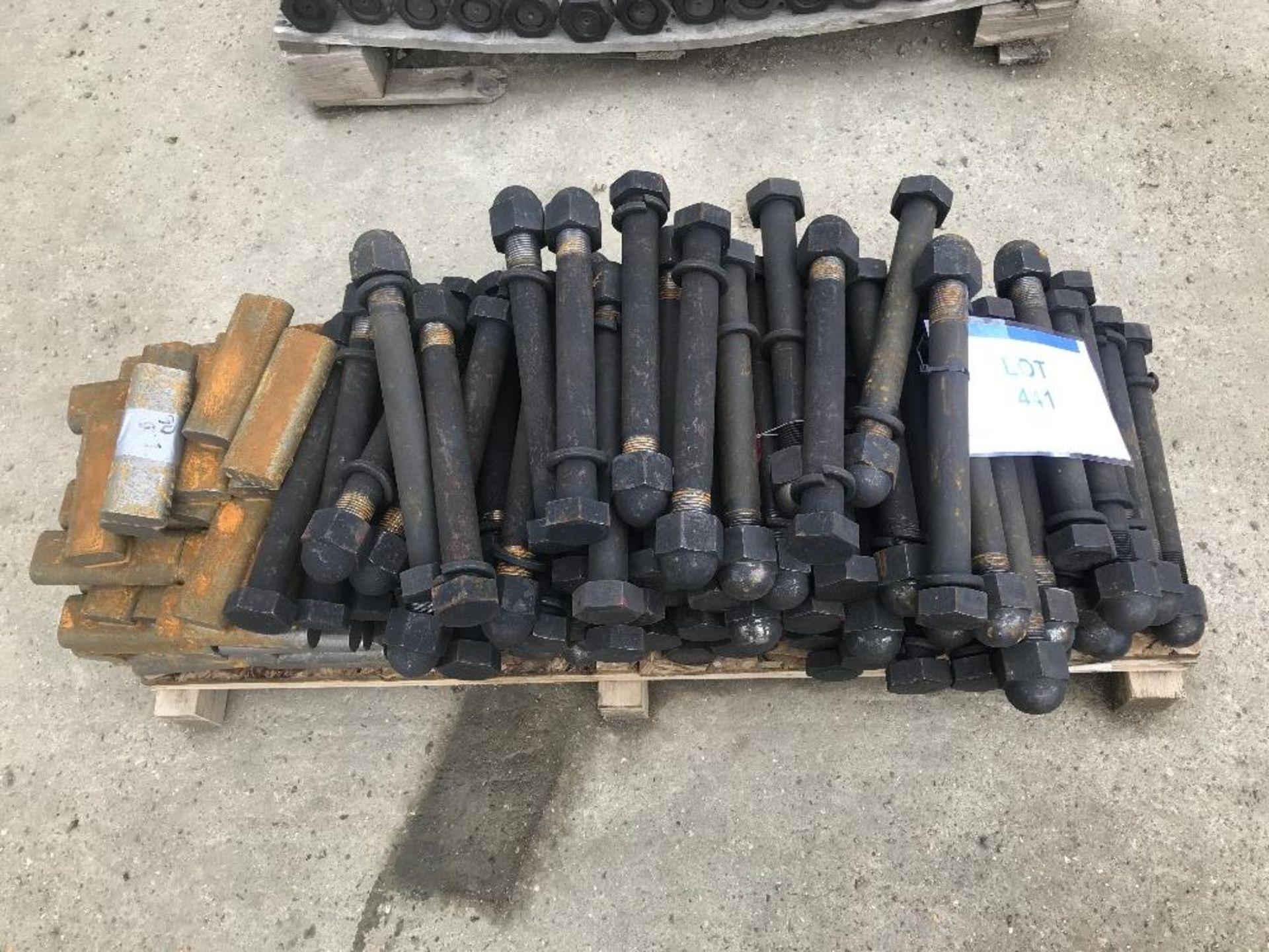 Pallet containing locking pins and heavy duty bolts