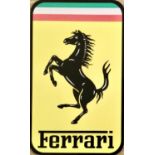 A large metal Ferrari-themed wall sign