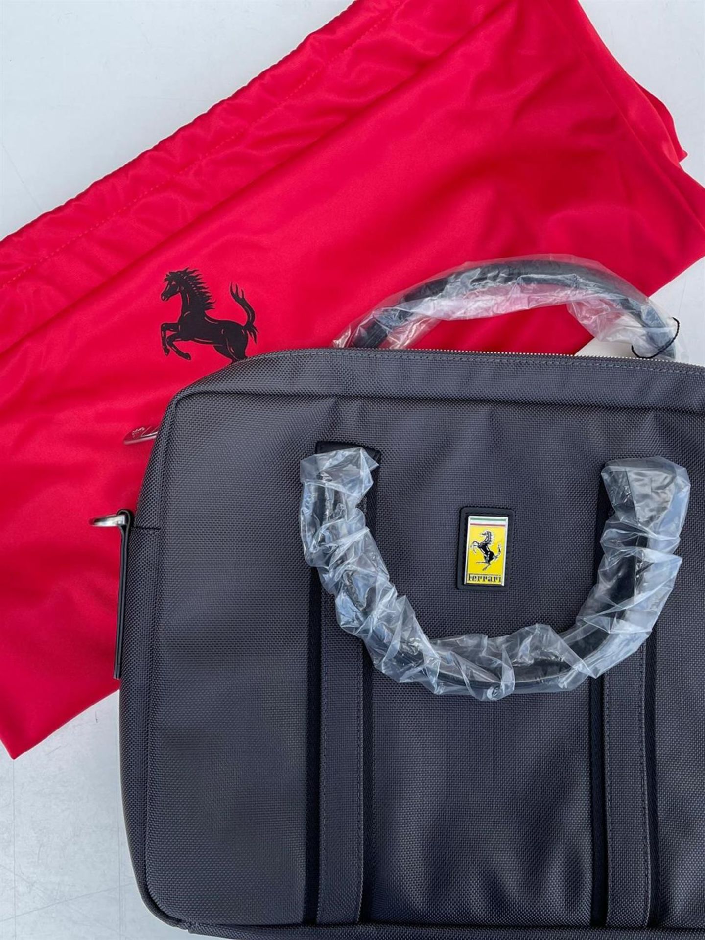 A Black Ferrari Laptop Case with Dust Cover