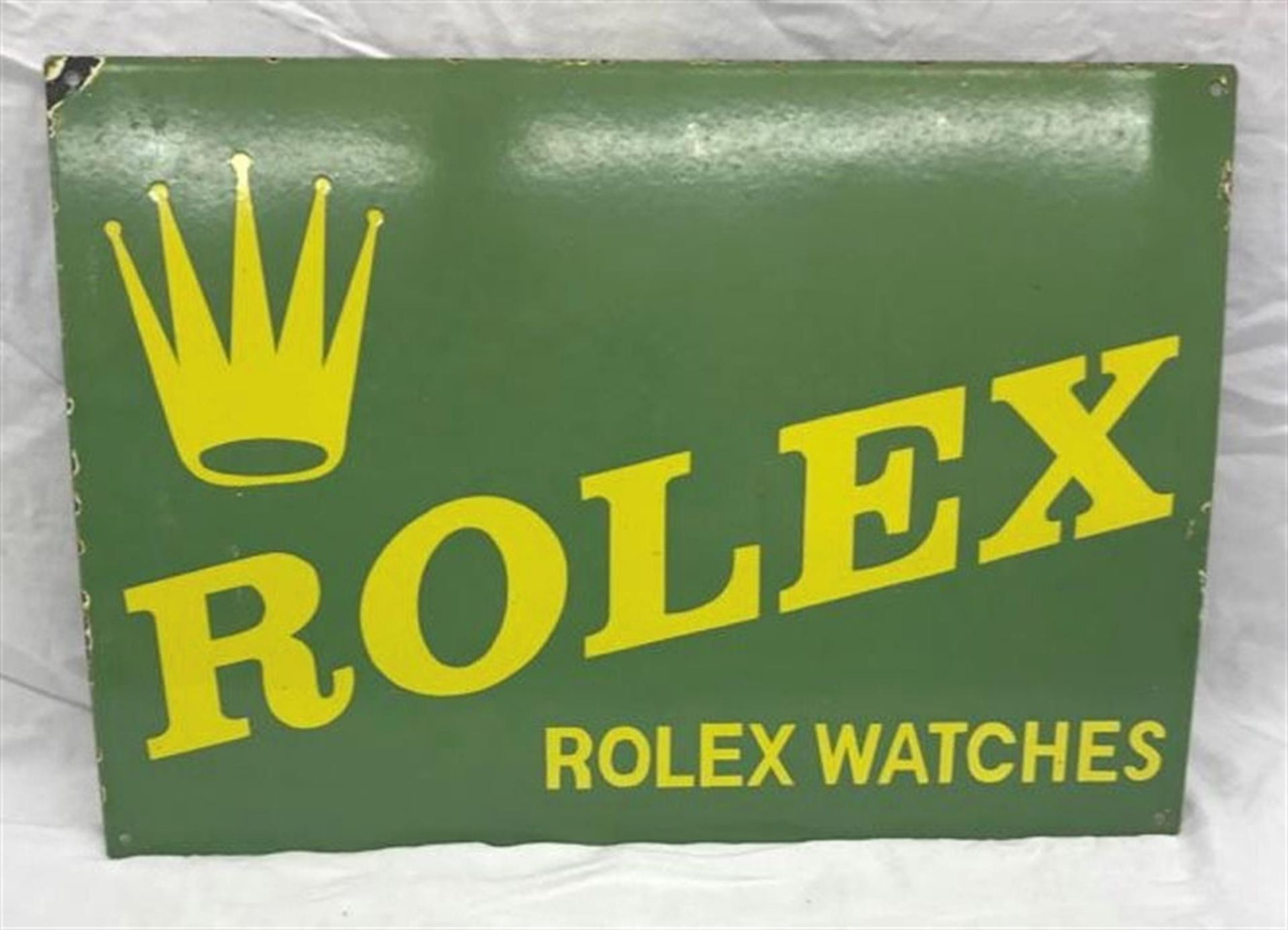 A vintage Rolex enamelled metal advertising sign.