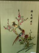 Framed and glazed oriental silk embroidery of birds and flowers, and another.