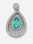 18ct white gold, emerald and diamond very fine filigree tear drop pendant.