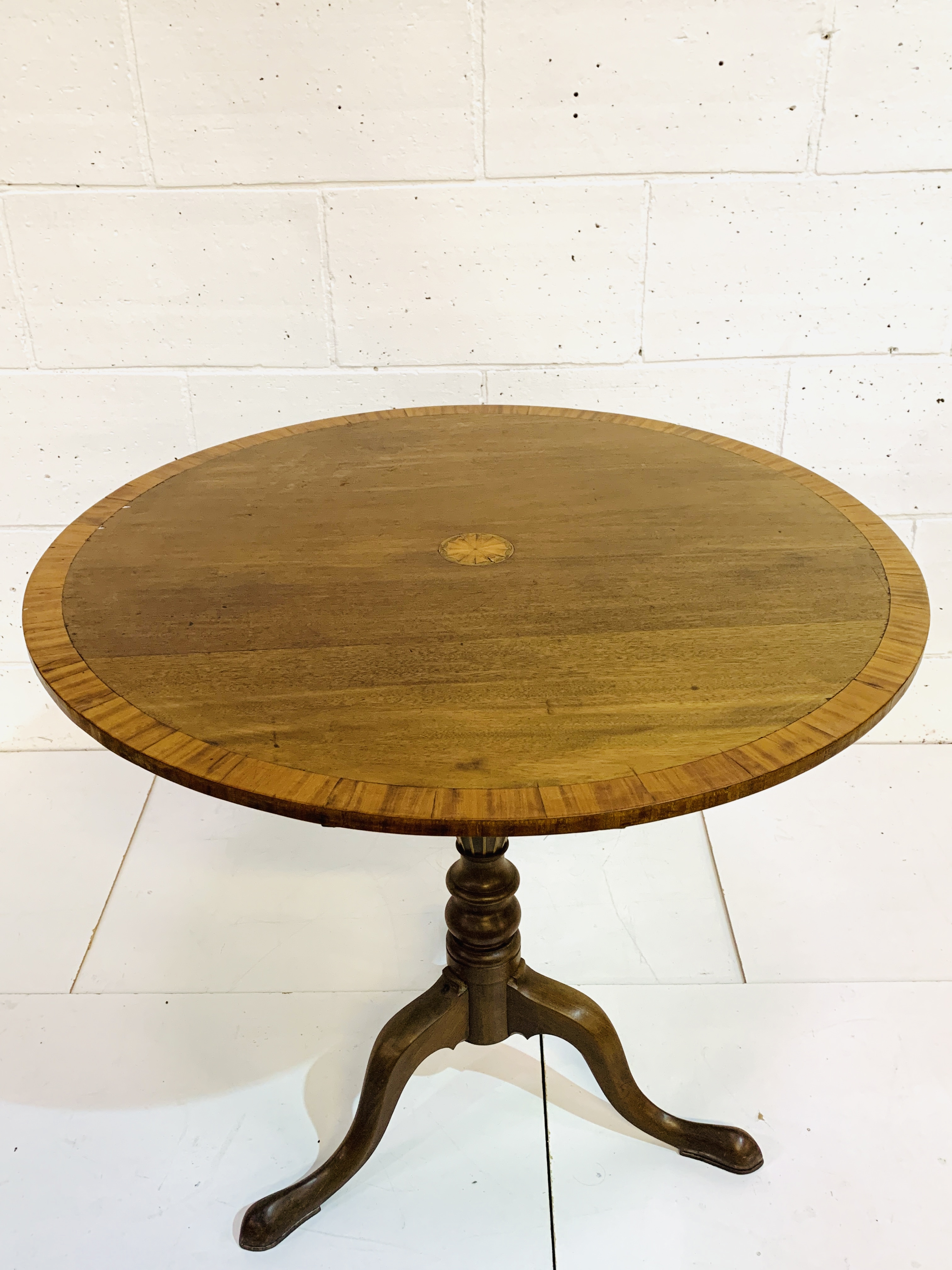 Mahogany circular tilt top table.