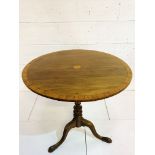 Mahogany circular tilt top table.