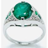 18ct white gold emerald ring with emeralds and diamonds to shoulder.