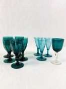 Nine Victorian green glass wine glasses