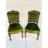 A pair of mahogany framed column sided dining chairs.