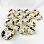 Eleven blue and gold hand painted Coalport cups and saucers
