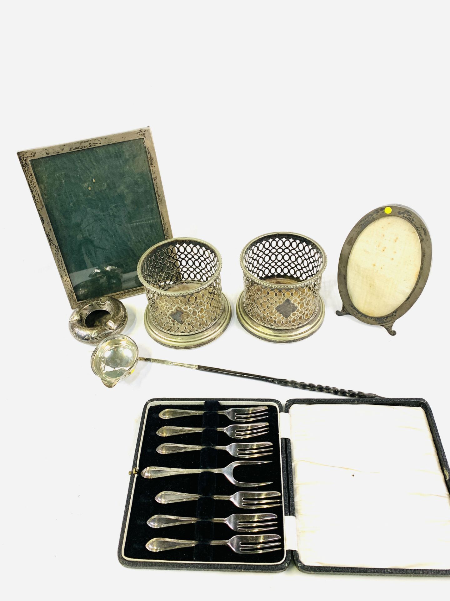Georgian silver toddy ladle, a pair of bottle coasters, and 2 silver photo frames