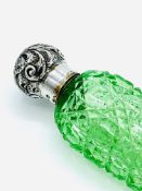 Late Victorian green cut glass perfume flask with a silver lid.