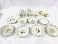 Fifteen pieces of Wedgwood Peter Rabbit china and two Royal Stafford 'Noddy' collection mugs.