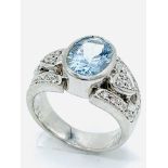 Platinum oval aquamarine set ring with diamonds to shoulders.
