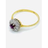 18 carat gold, ruby and diamond cluster ring.