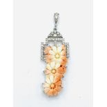 18ct white gold and floral carved coral pendant.