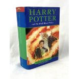 Harry Potter and the Half-Blood Prince, First Edition, by J K Rowling.