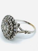 White gold diamond cluster ring.