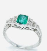 18ct white gold, emerald and diamond ring.
