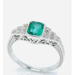 18ct white gold, emerald and diamond ring.