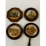 Four assorted Victorian pot lids in hardwood frames.