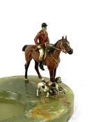 Green onyx ashtray, mounted with a cold painted bronze figure of a huntsman with hounds