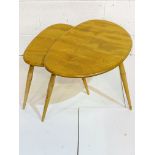 Nest of two Ercol pebble tables.