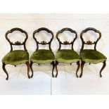 Set of four Victorian mahogany balloon back dining chairs.