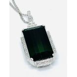 18ct white gold and baguette cut green stone and diamond pendant, on 18ct white gold chain.