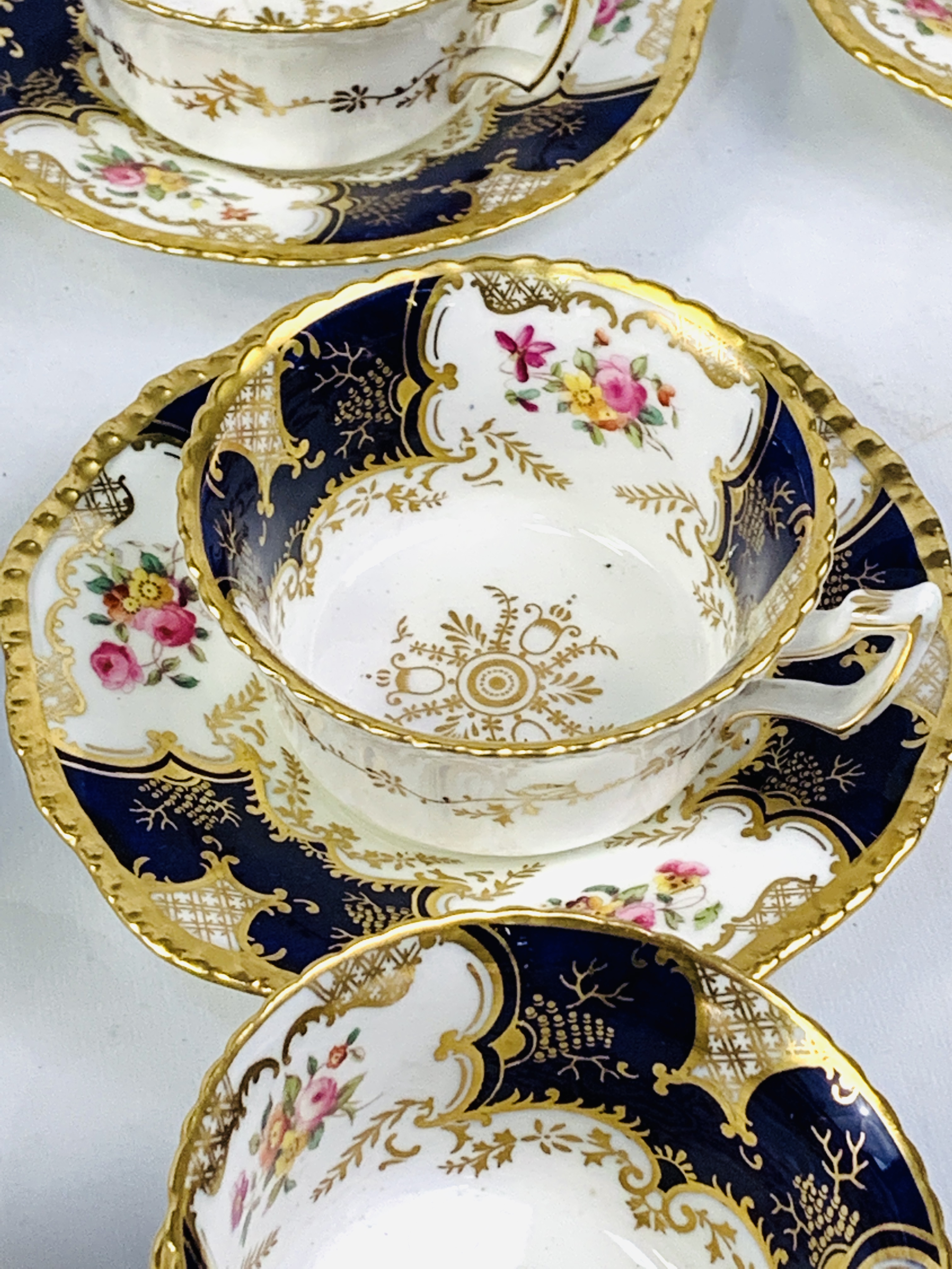 Eleven blue and gold hand painted Coalport cups and saucers - Image 4 of 6