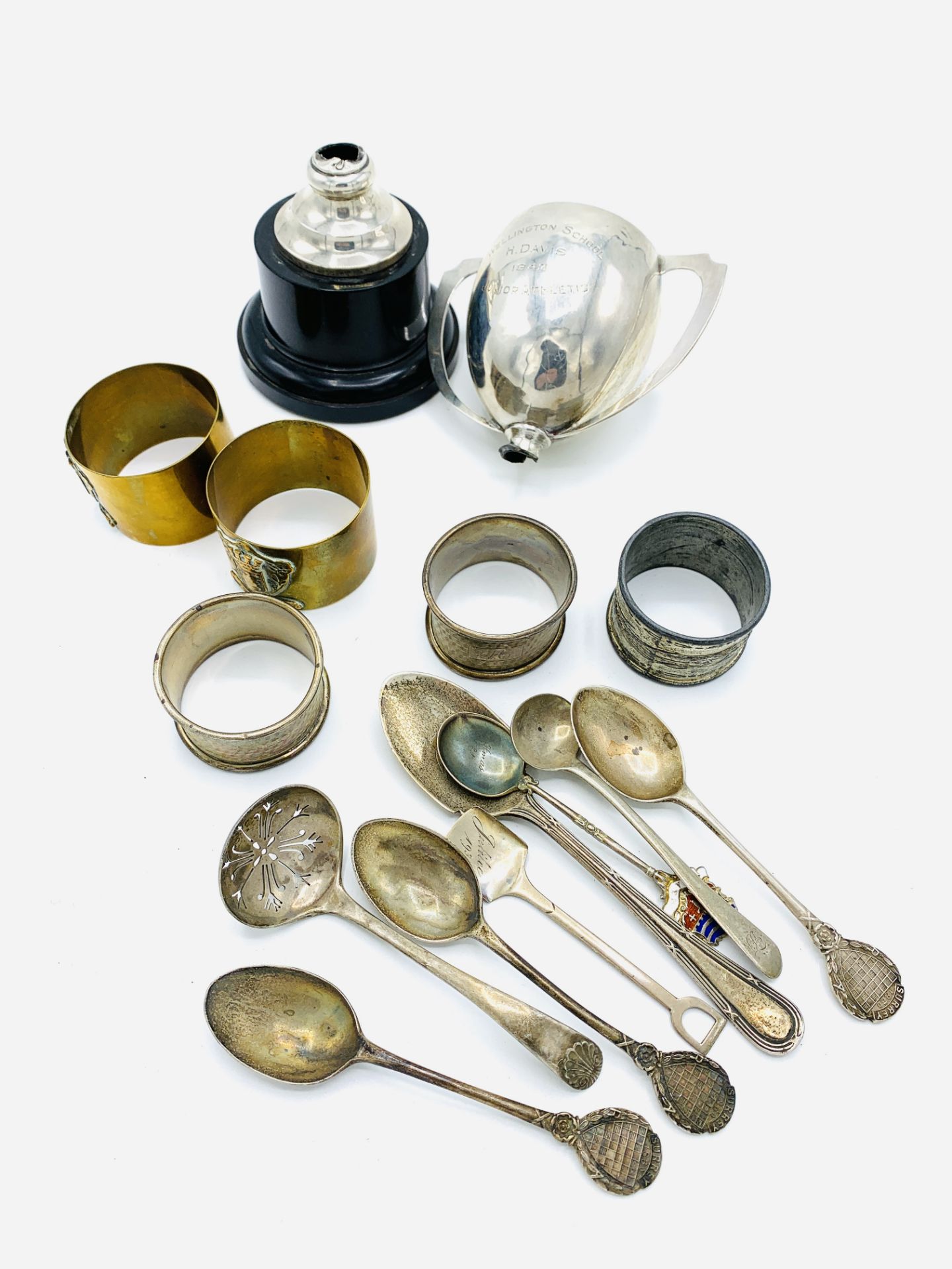 Eight various silver spoons, a silver trophy and other silver items