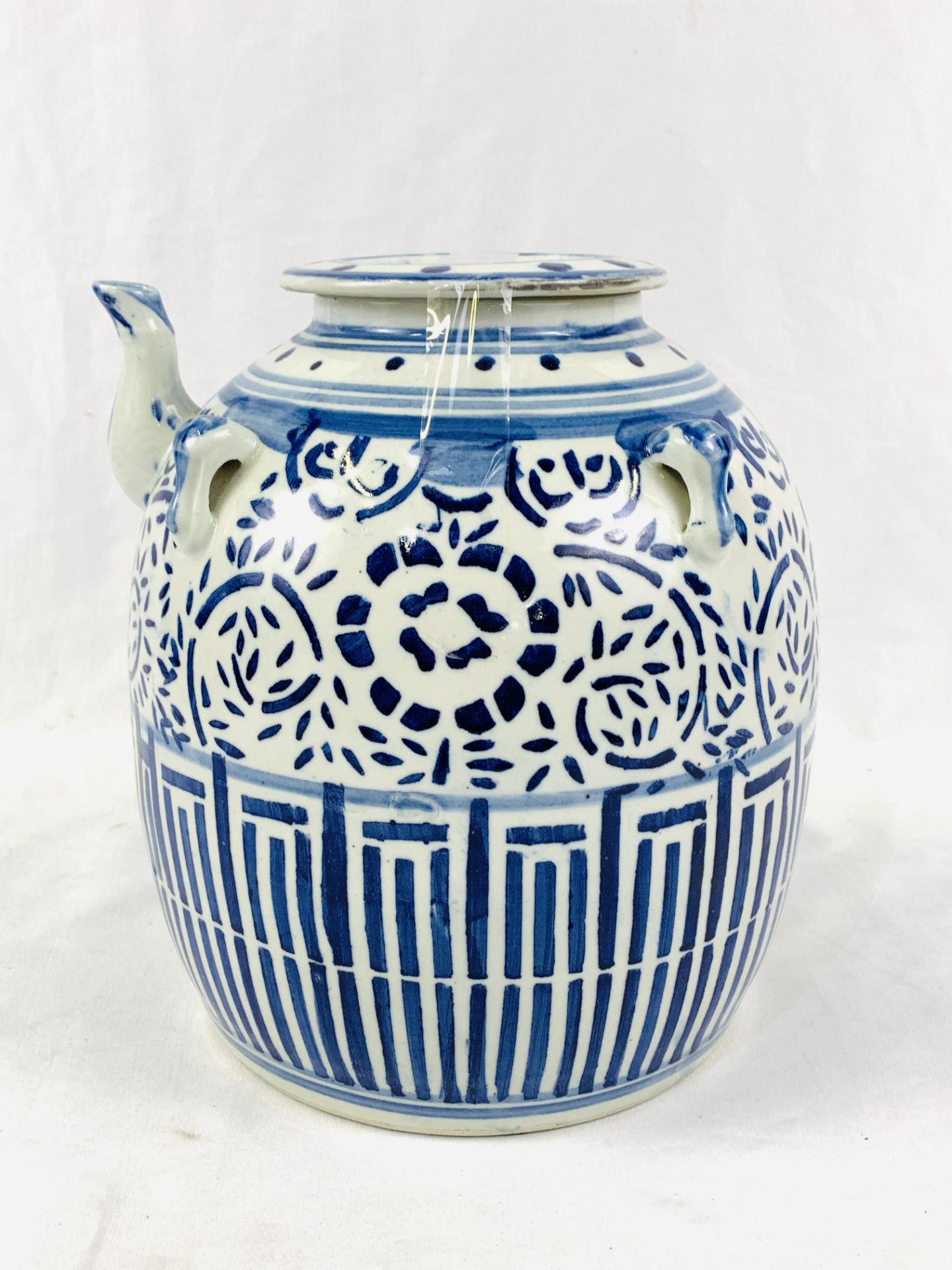 Large blue and white Oriental style jar with spout