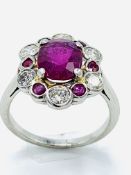 Platinum, ruby and diamond cluster ring.