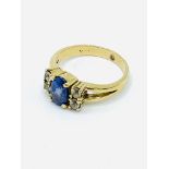 18ct gold deep blue tanzanite and diamond ring