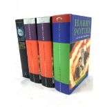 Three copies of Harry Potter and the Deathly Hallows, First Edition, by J K Rowling, and another.