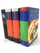 Three copies of Harry Potter and the Deathly Hallows, First Edition, by J K Rowling, and another.