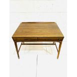 A 1950's Danish Rosewood desk designed by Svend Madsen for Mobelfabrik