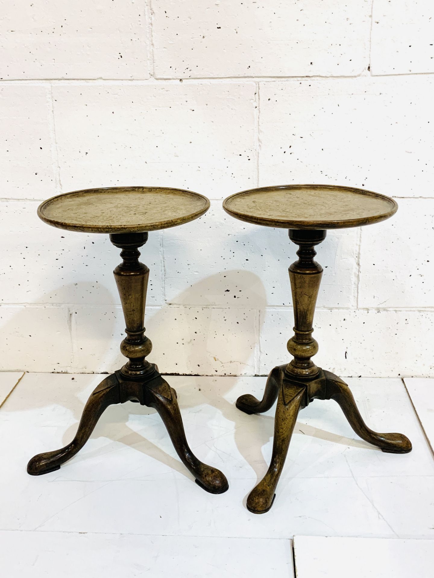 Pair of mahogany wine tables with walnut tops.