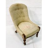Victorian lady's drawing room chair with button back upholstery.
