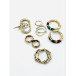 Seven pairs of 9ct gold hoop earrings