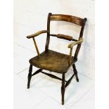 Victorian elm seat ladder back elbow chair.