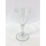 An 18th Century cut and engraved wine glass.