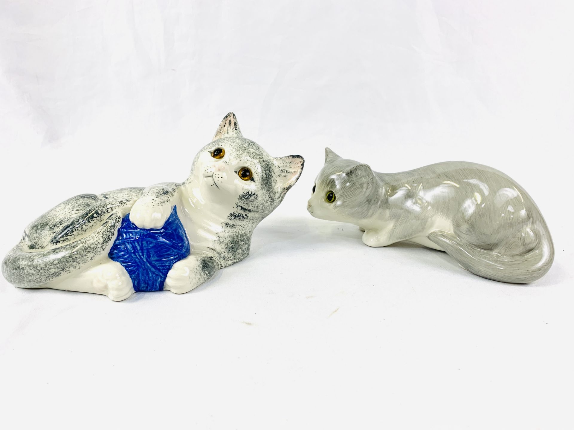Two juvenile Staffordshire cat figures
