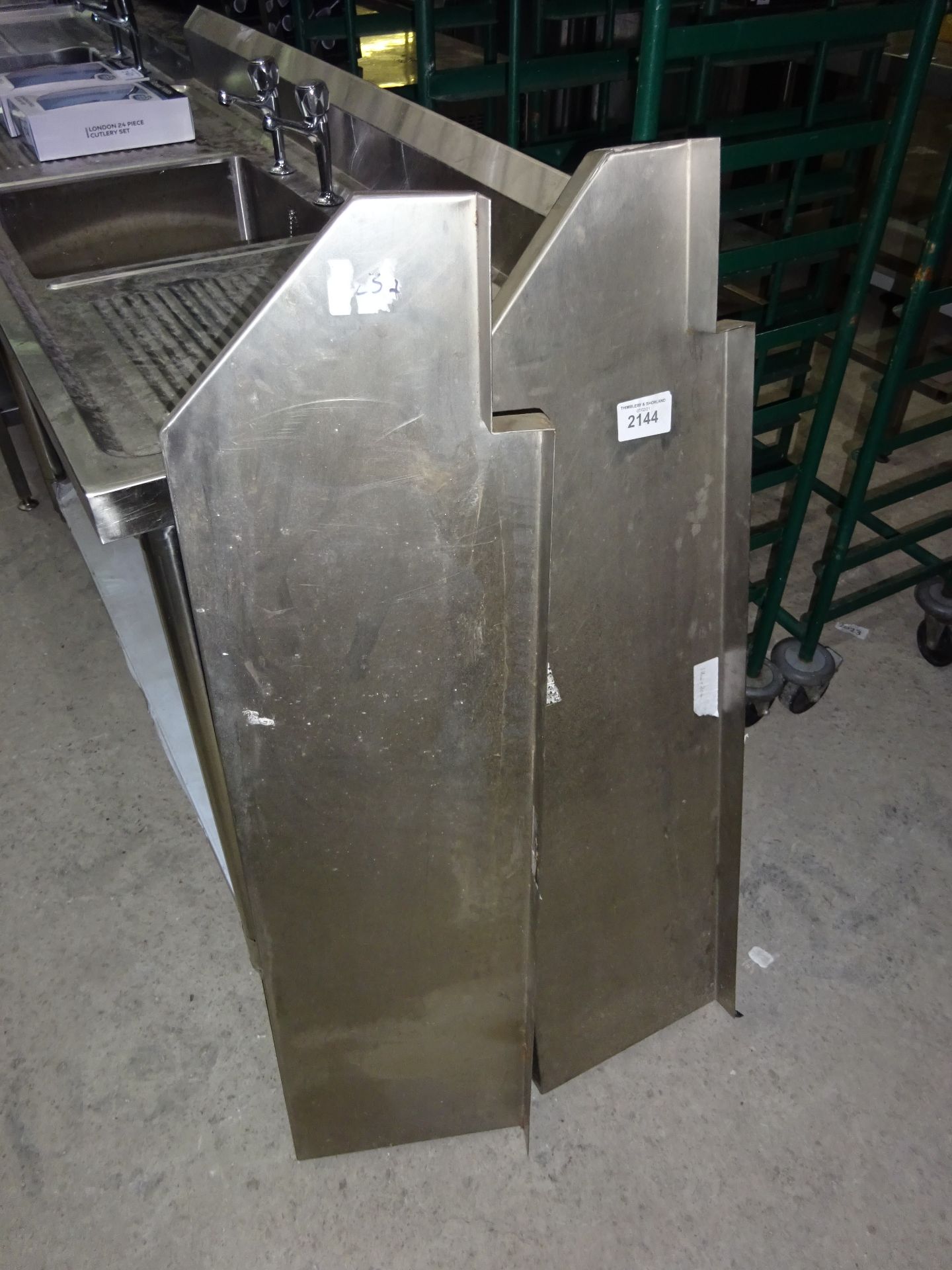 Two stainless steel shelfs, width 113cms, depth 30cms.