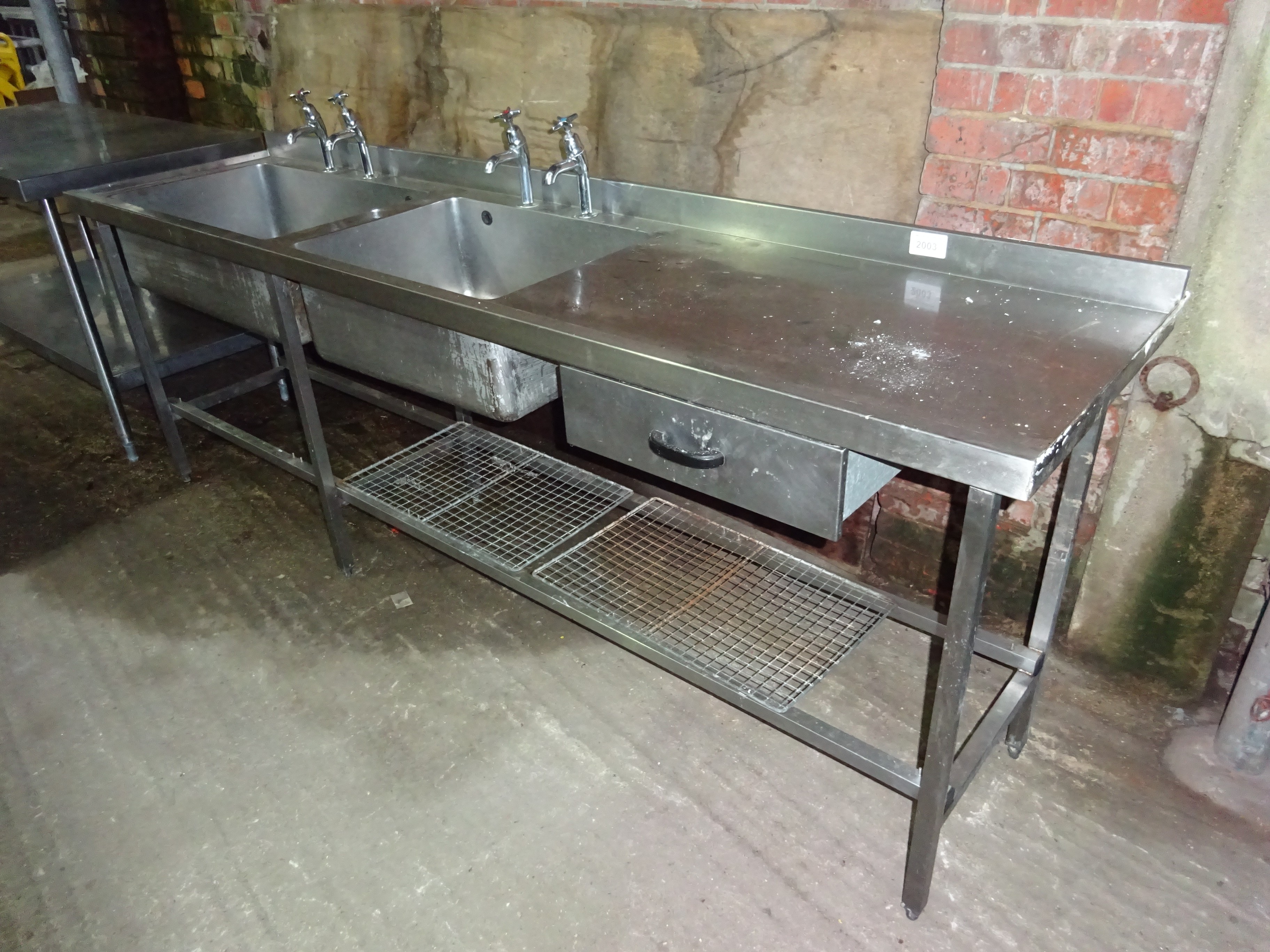 Stainless steel double sink, right hand drainer with taps, drawer and undershelf.