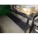 Stainless steel preparation table with under shelf, together with a can opener.