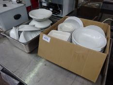 Two boxes of white china.