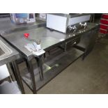 Stainless steel prep table with drawer, shelf and tin opener.