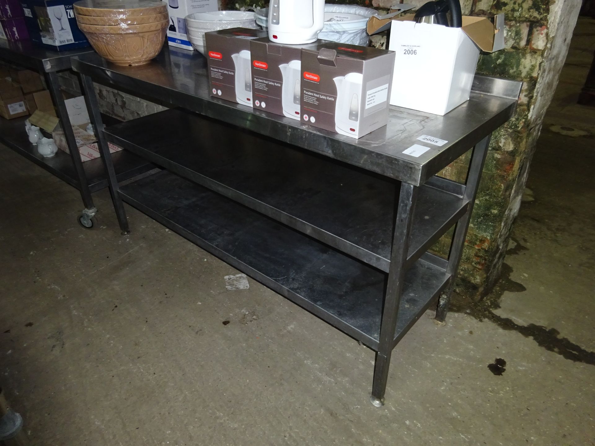 Stainless steel preparation table with two under shelfs.