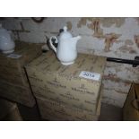 Eight Villeroy & Boch china teapots.